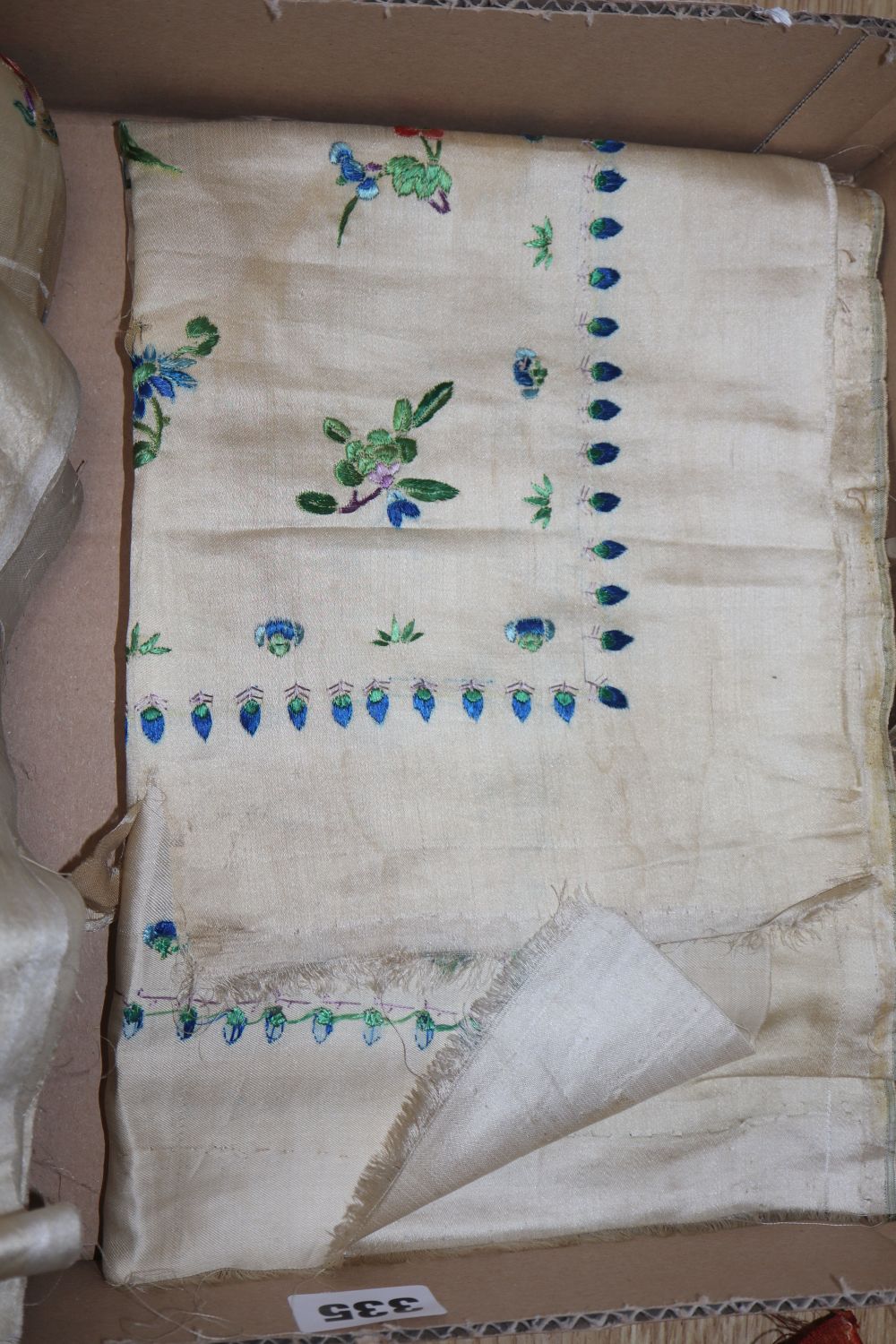 Two pairs of Chinese embroidered panels, embroidered on cream silk with all over multi-coloured birds, butterflies, fish and flowers an